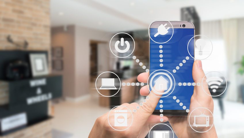Smart home automation app on mobile with home interior in background. Internet of things concept at home. Smart technology 4.0